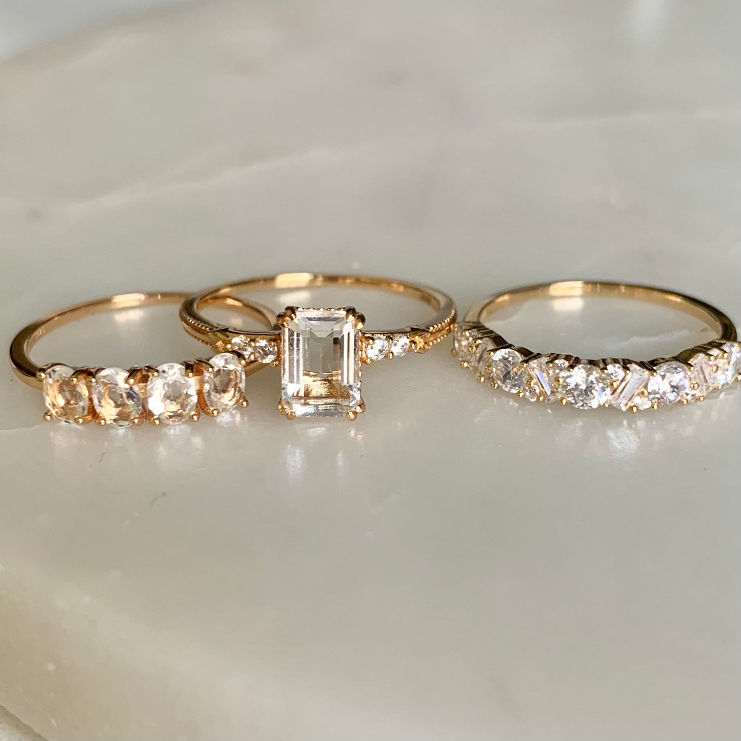 Our Jocelyn ring has a total of seventeen cubic zirconia crystals, they are setting alternately along halfway on a 18k gold plated band. Joycelyn is a beautiful statement ring to wear on its own. It also goes so well with our other stacking rings.