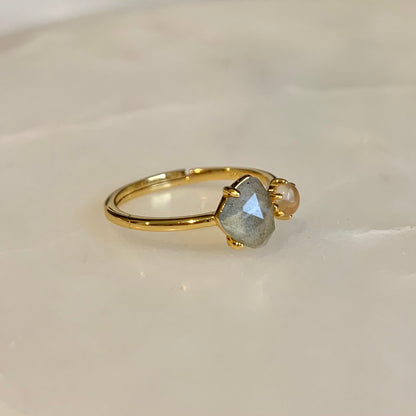 The Clementine Labradorite Ring has a natural labradorite and rose quartz set on the gold band. Labradorite and Rose Quartz is the perfect combination of self-protection and self-love. They accomplished each other by encouraging you to explore your magical and powerful self, while calming your mind and against negative.