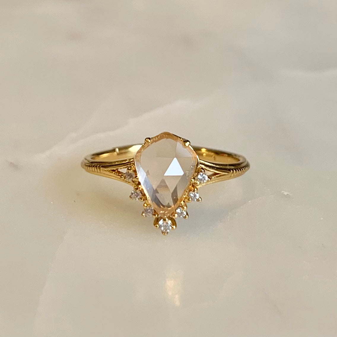 This Victoria Rose Quartz Ring features a unique fairy-tale design, crafted with a teardrop natural rose quartz and accented with cubic zirconia crystals along its tip. Its delicate feminine aesthetics make it the perfect accessory to complete any outfit.