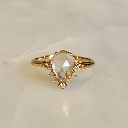 This Victoria Rose Quartz Ring features a unique fairy-tale design, crafted with a teardrop natural rose quartz and accented with cubic zirconia crystals along its tip. Its delicate feminine aesthetics make it the perfect accessory to complete any outfit.